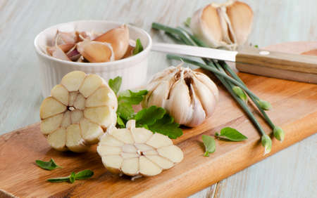 Fresh garlic on wooden background. Selective focus.の写真素材