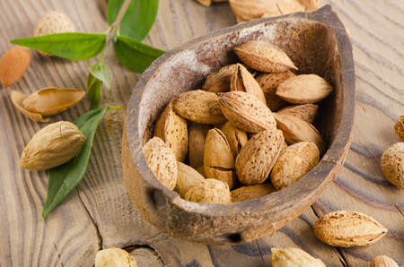 Almond nuts on wooden table. Selective focusの写真素材