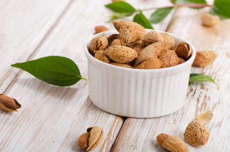 Almond nuts on wooden table. Selective focusの写真素材