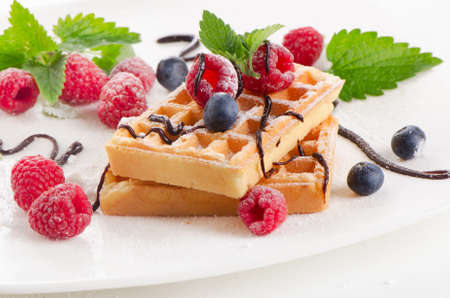 Belgian waffles with  fresh berries. Selective focusの写真素材