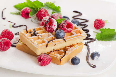 Belgian waffles with  fresh berries. Selective focusの写真素材