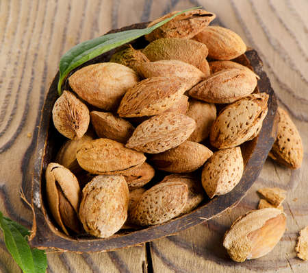 Almonds  on a wooden table. Selective focusの写真素材