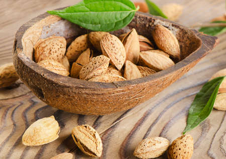 Almonds  on a wooden table. Selective focusの写真素材
