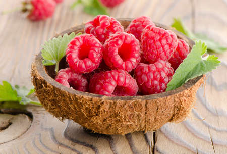 Fresh raspberries  with leaves . Selective focusの写真素材