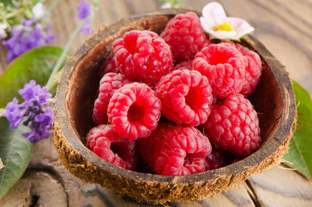 Fresh raspberries  with leaves . Selective focusの写真素材