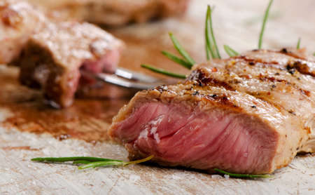 beef steak on a wooden table. Selective focusの写真素材