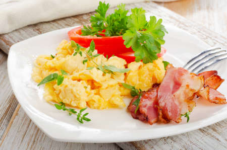 Breakfast - Scrambled eggs and bacon . Selective focusの写真素材