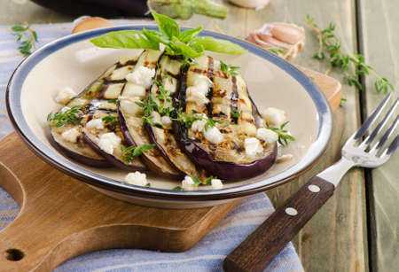 Grilled eggplant slices on a plate. Selective focusの写真素材