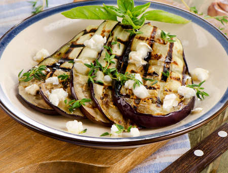 Grilled eggplant slices on a plate. Selective focusの写真素材