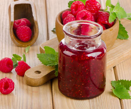 Glass jar of jam with fresh raspberries  .Selective focusの写真素材