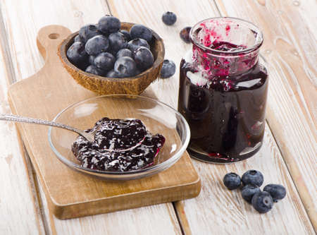 Fresh blueberries jam in a glass  jar. Selective focusの写真素材