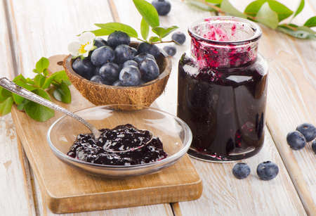 Fresh blueberries jam in a glass  jar. Selective focusの写真素材