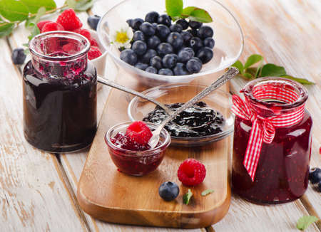 Jam with fresh berries on a wooden table  Selective focusの写真素材