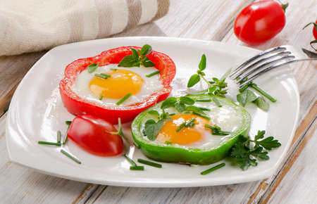 Healthy breakfast - fried eggs with herbs and paprika   Selective focusの写真素材