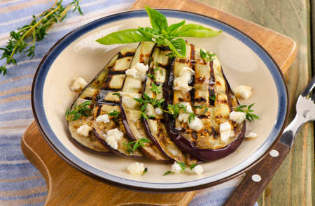 Grilled eggplant slices on a plate. Selective focusの写真素材