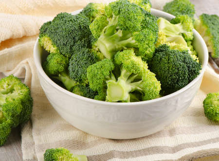 Fresh green broccoli  on a  wooden table. Selective focusの写真素材