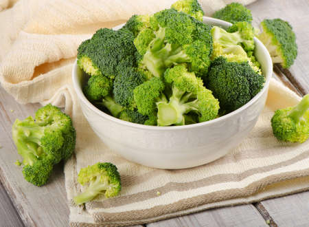 Fresh green broccoli  on a  wooden table. Selective focusの写真素材