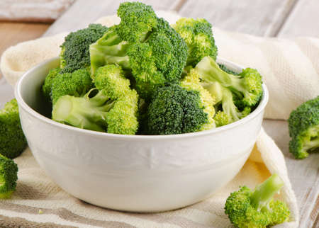 Fresh green broccoli  on a  wooden table. Selective focusの写真素材