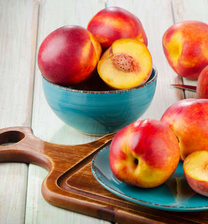 Ripe juicy nectarines  on a wooden table  Selective focusの写真素材