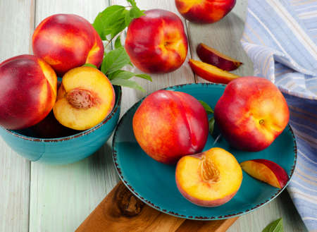 Ripe juicy nectarines  on a wooden table  Selective focusの写真素材
