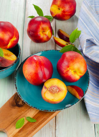 Ripe juicy nectarines  on a wooden table  Selective focusの写真素材