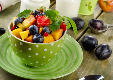 Healthy breakfast - fresh fruit salad and yogurt. Selective focusの写真素材