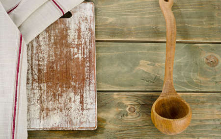 Napkin with wooden spoon on a  wooden table