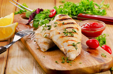 Grilled chicken breast with fresh vegetables . Selective focusの写真素材