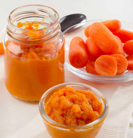 Baby healthy  food -  pureed carrot and juice. Selective focusの写真素材