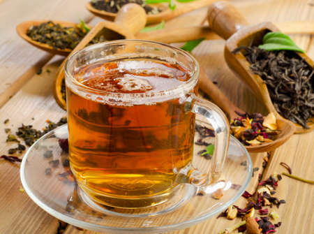 Cup of tea and assortment of dry tea in spoon . Selective focusの写真素材