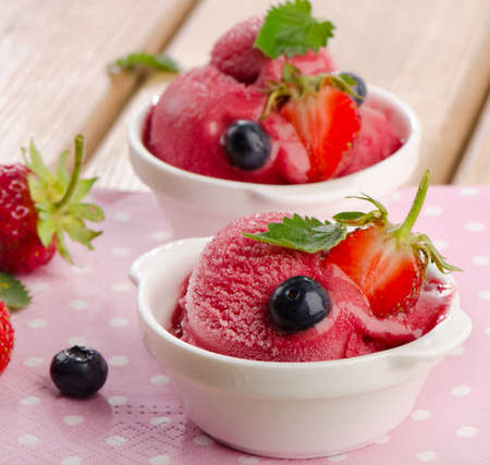 Ice cream   with fresh berries and mint. Selective focusの写真素材