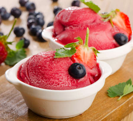 Ice cream   with fresh berries and mint. Selective focusの写真素材