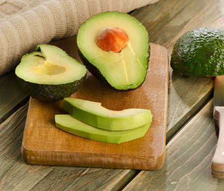 Fresh avocado on cutting board. Selective focusの写真素材