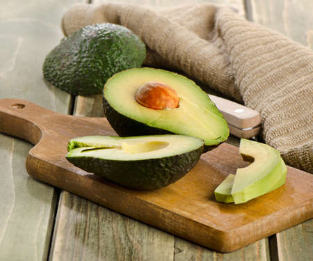 Fresh avocado on cutting board. Selective focusの写真素材