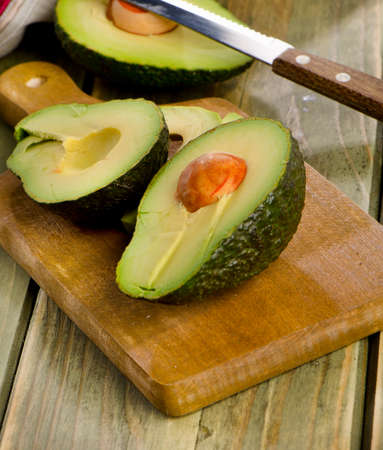 Fresh avocado on cutting board. Selective focusの写真素材