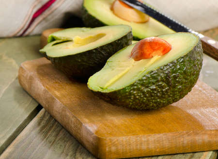 Fresh avocado on cutting board. Selective focusの写真素材