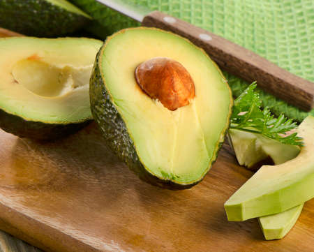 Fresh avocado on cutting board. Selective focusの写真素材