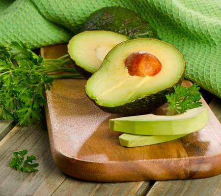 Fresh avocado on cutting board. Selective focusの写真素材