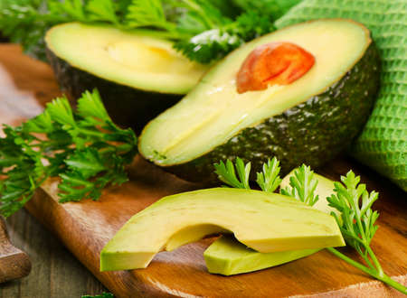 Fresh avocado on cutting board. Selective focusの写真素材