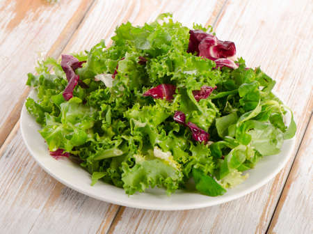 Lettuce salad  on a wooden table. Selective focusの写真素材