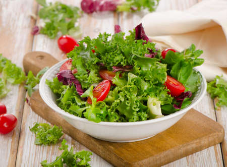 Lettuce salad  on a wooden table. Selective focusの写真素材