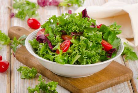 Lettuce salad  on a wooden table. Selective focus の写真素材
