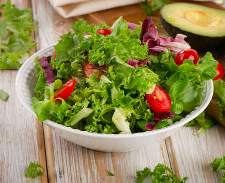 Lettuce salad  on a wooden table. Selective focusの写真素材
