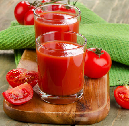 Fresh tomato juice with ripe tomatoes and herbs . Selective focusの写真素材