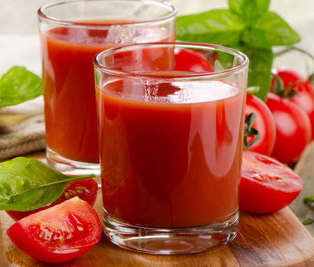 Tomato juice with fresh tomatoes and herbs . Selective focusの写真素材