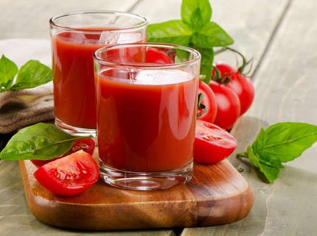 Tomato juice with fresh tomatoes and herbs . Selective focusの写真素材