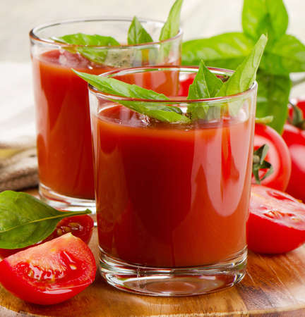 Fresh tomato juice with ripe tomatoes and herbs . Selective focusの写真素材