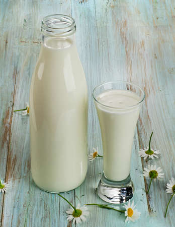 Fresh milk on a wooden table. Selective focusの写真素材