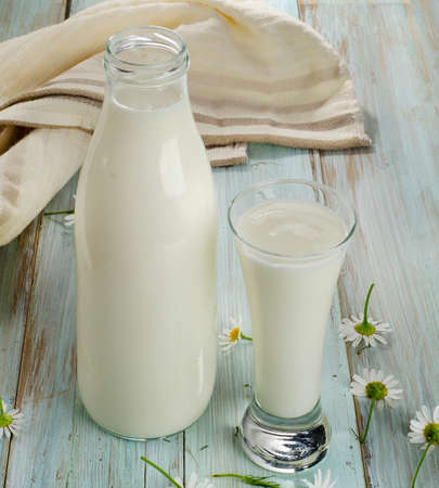 Fresh milk on a wooden table. Selective focusの写真素材