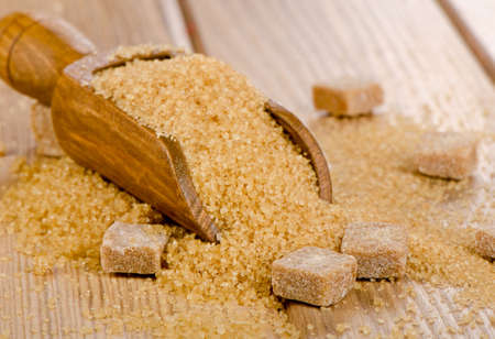 Brown sugar on wooden table. Selective focusの写真素材